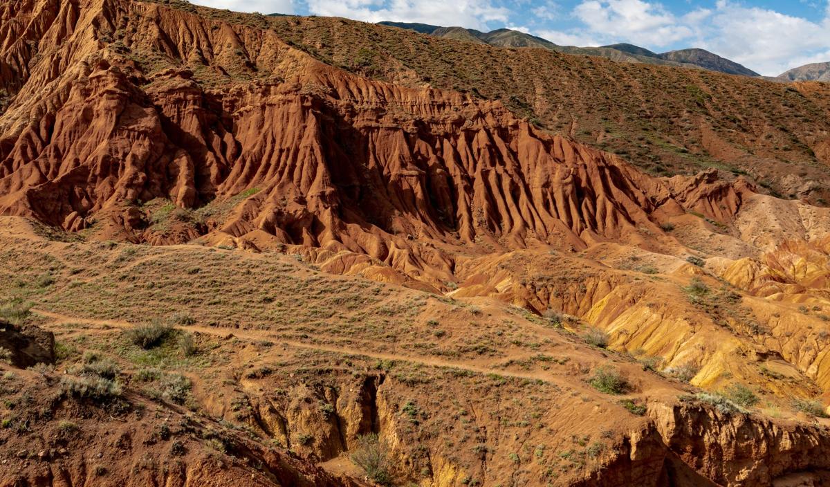 Red and orange clay formations of Skazka Canyon near Issyk-Kul